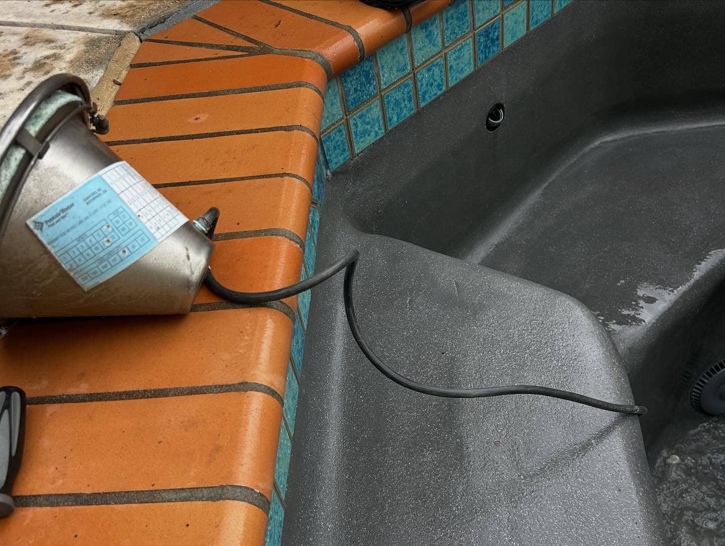 Pool Maintenance in Santa Clarita, CA, Expert pool technicians from A+ Plus Pool Cleaning performing detailed cleaning and maintenance for a sparkling pool in Los Angeles County, CA