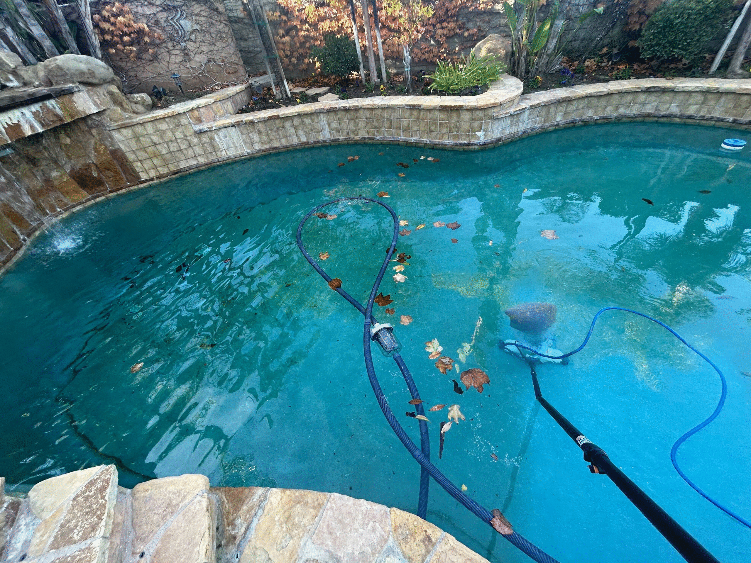 Pool Cleaning in Santa Clarita, CA, An expert pool technician assessing the water quality and equipment functionality during a service visit in Los Angeles County, CA, A+ Plus Pool Cleaning professional conducting thorough water quality test in Saugus pool, ensuring optimal health and safety standards