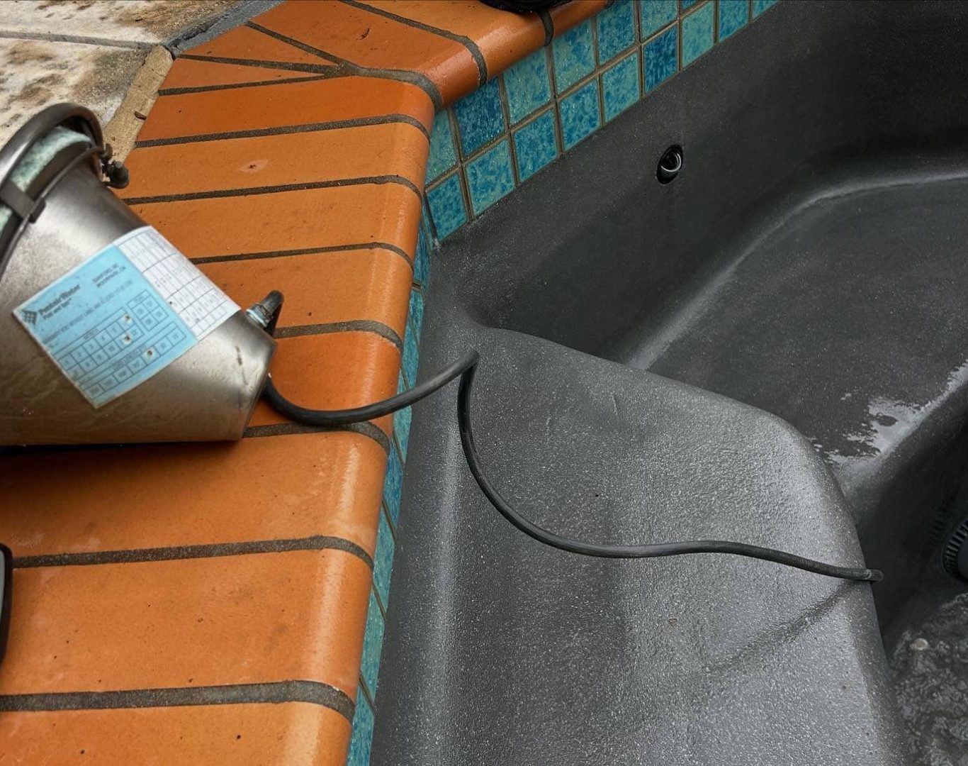 Pool Maintenance in Santa Clarita, CA, Expert pool technicians from A+ Plus Pool Cleaning performing detailed cleaning and maintenance for a sparkling pool in Los Angeles County, CA